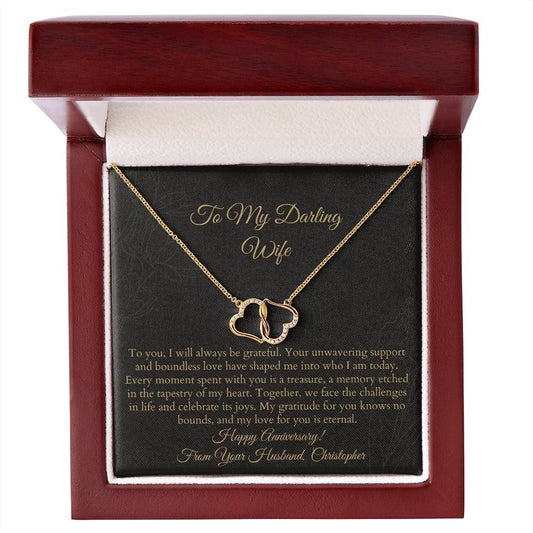 The Everlasting Love Pair of Hearts Solid Yellow Gold Necklace with Diamonds, inside a Luxurious Mahogany-Style Gift Box with LED